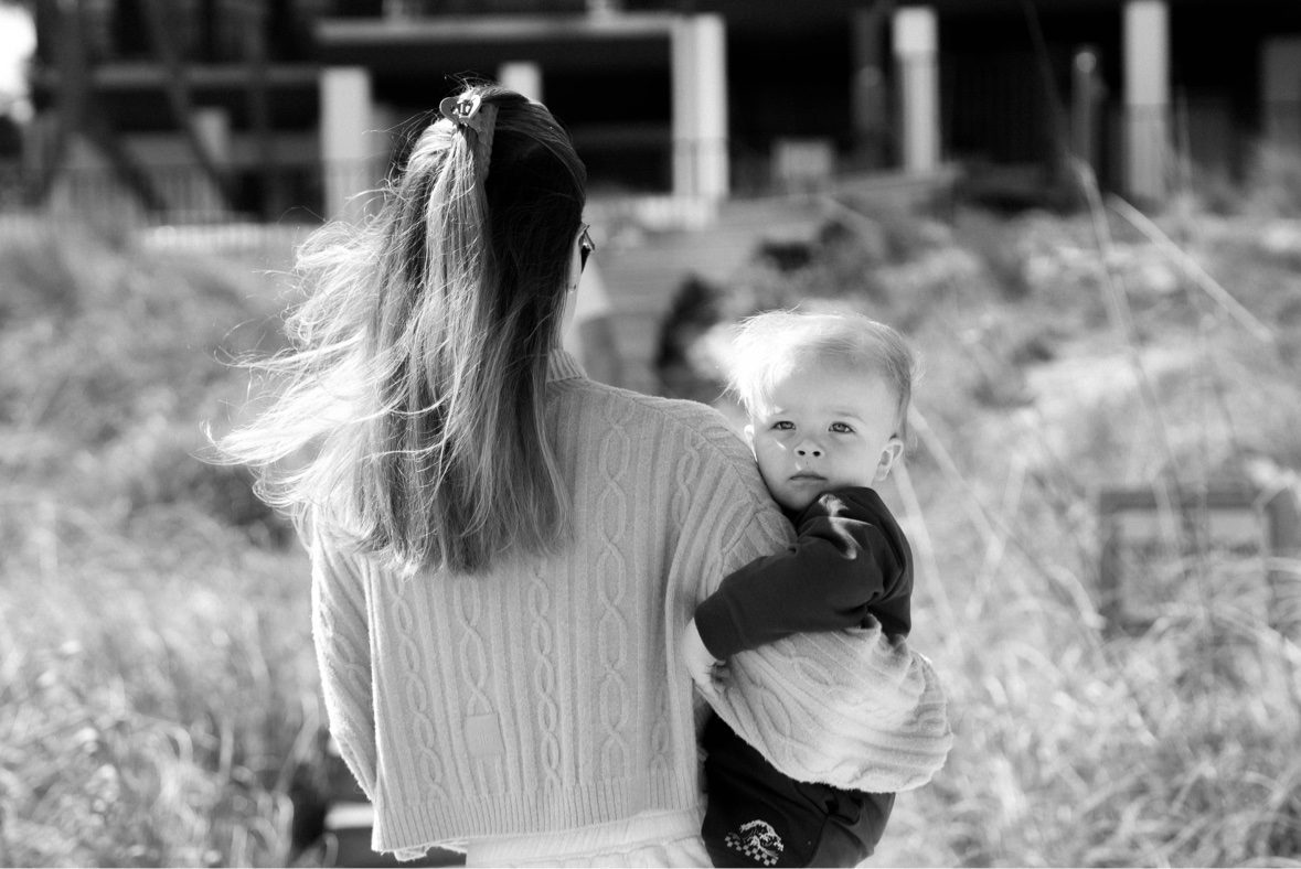 Black and white photograph of a mother holding her baby