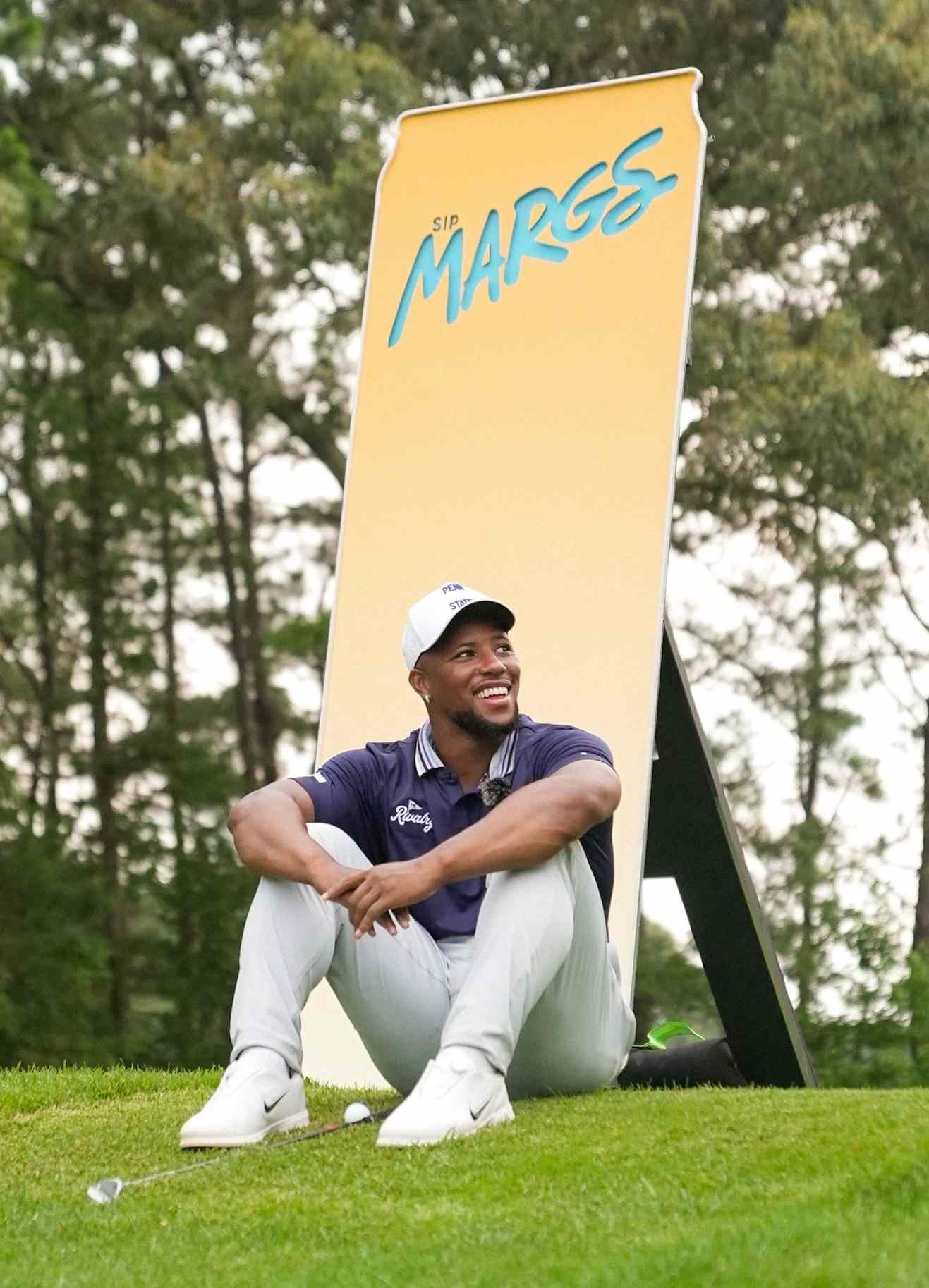 Saquon Barkley at the SipMARGS AMPT Rivalry Golf Outing, photographed by Eric Elfstrom